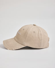 Beige baseball cap on a light gray background