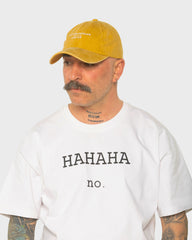 A man wearing the London Mustard Washed Cap