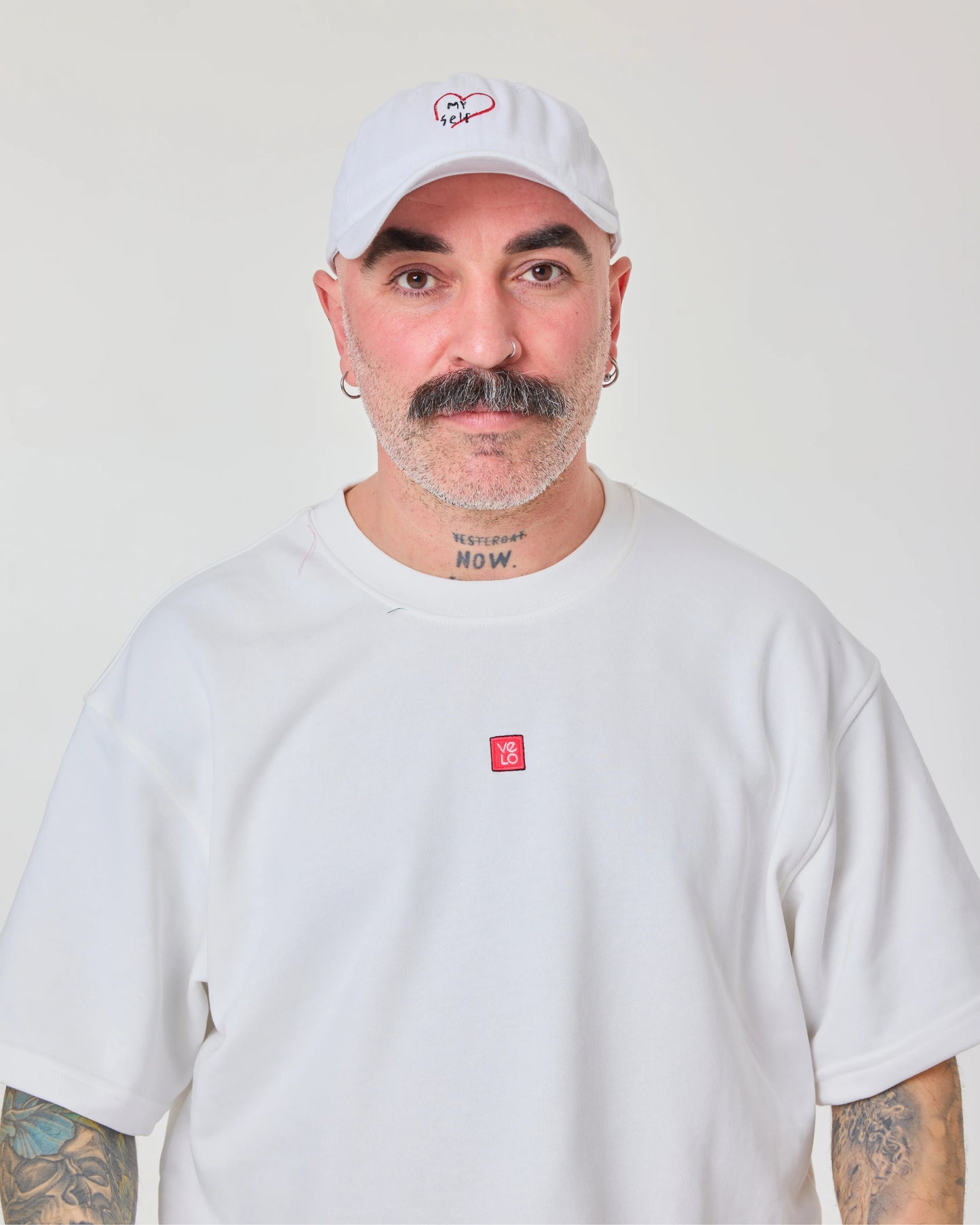 front look of male model wearing love myself embroidered white washed cap