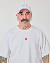 front look of male model wearing love myself embroidered white washed cap