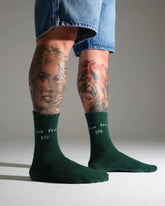 model wearing love you bye green socks