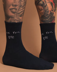 Navy socks with 'love you, bye' text on a brown background