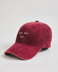 Red cap with 'Love You, Bye' text on a light gray background