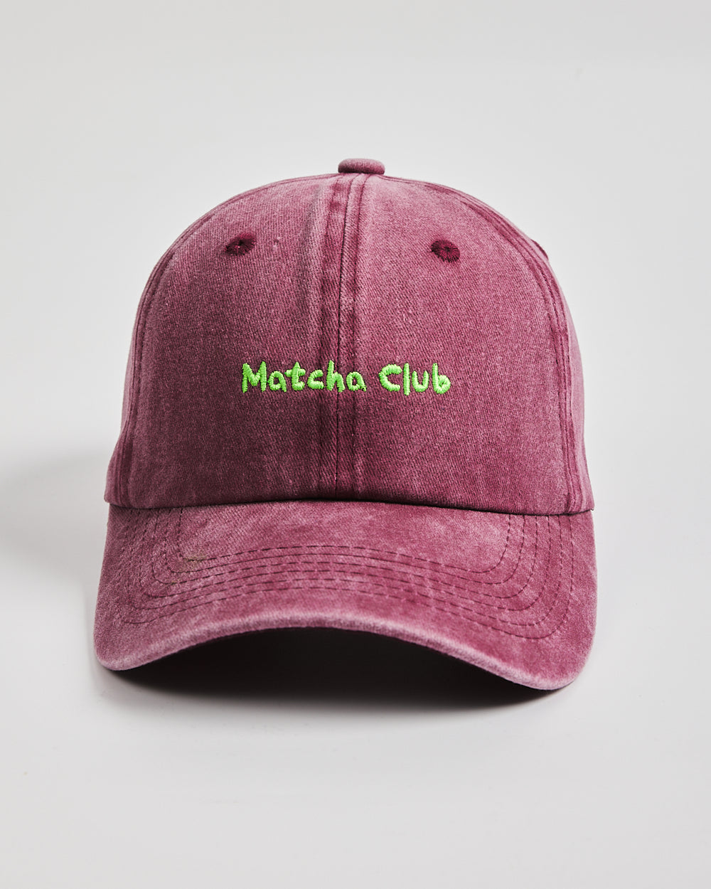 Front view of Matcha Club Burgundy Washed Caps