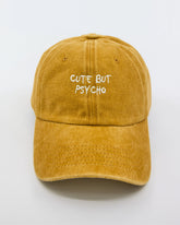 front view of Cute But Psycho Mustard Washed Cap