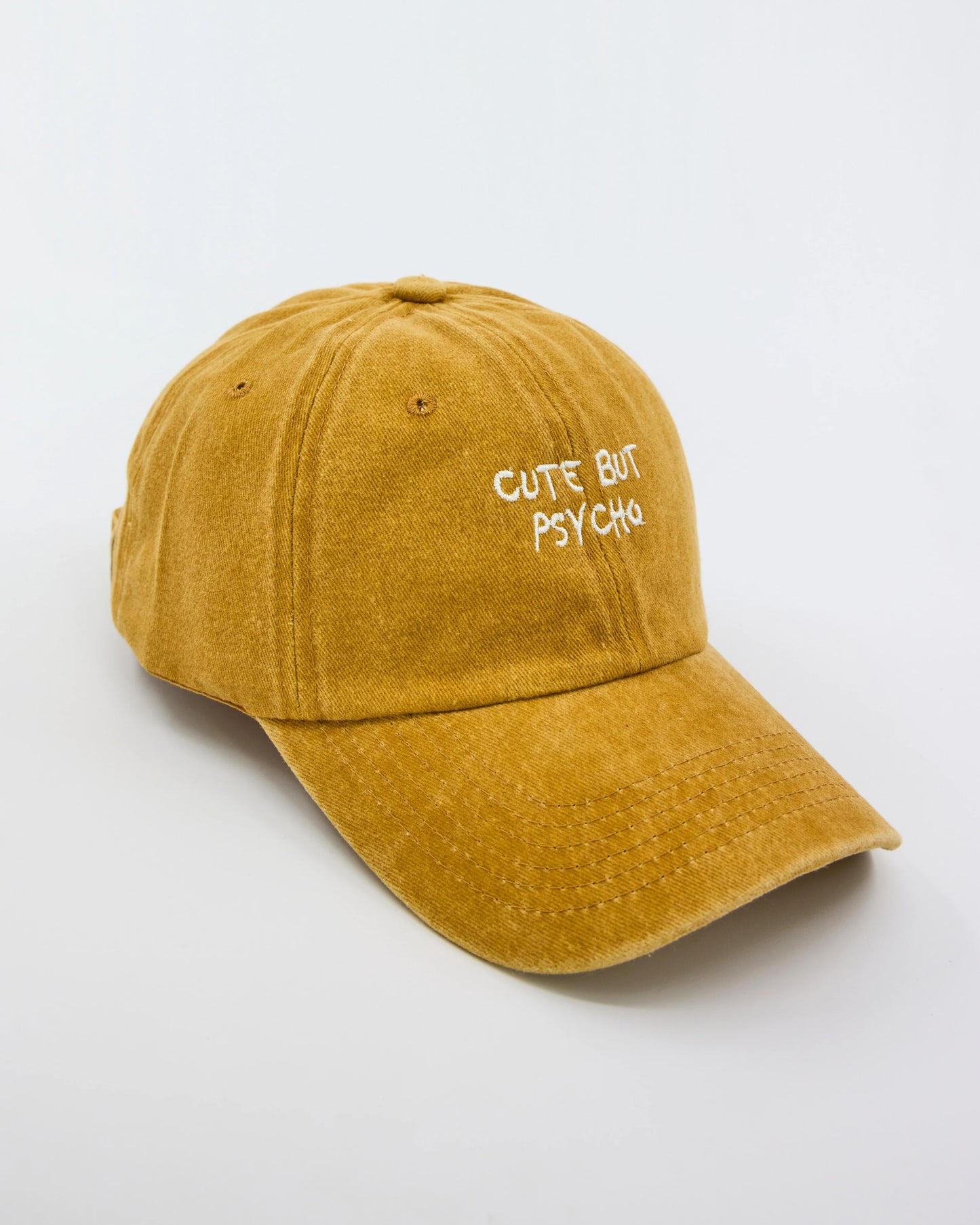side view of Cute But Psycho Mustard Washed Cap