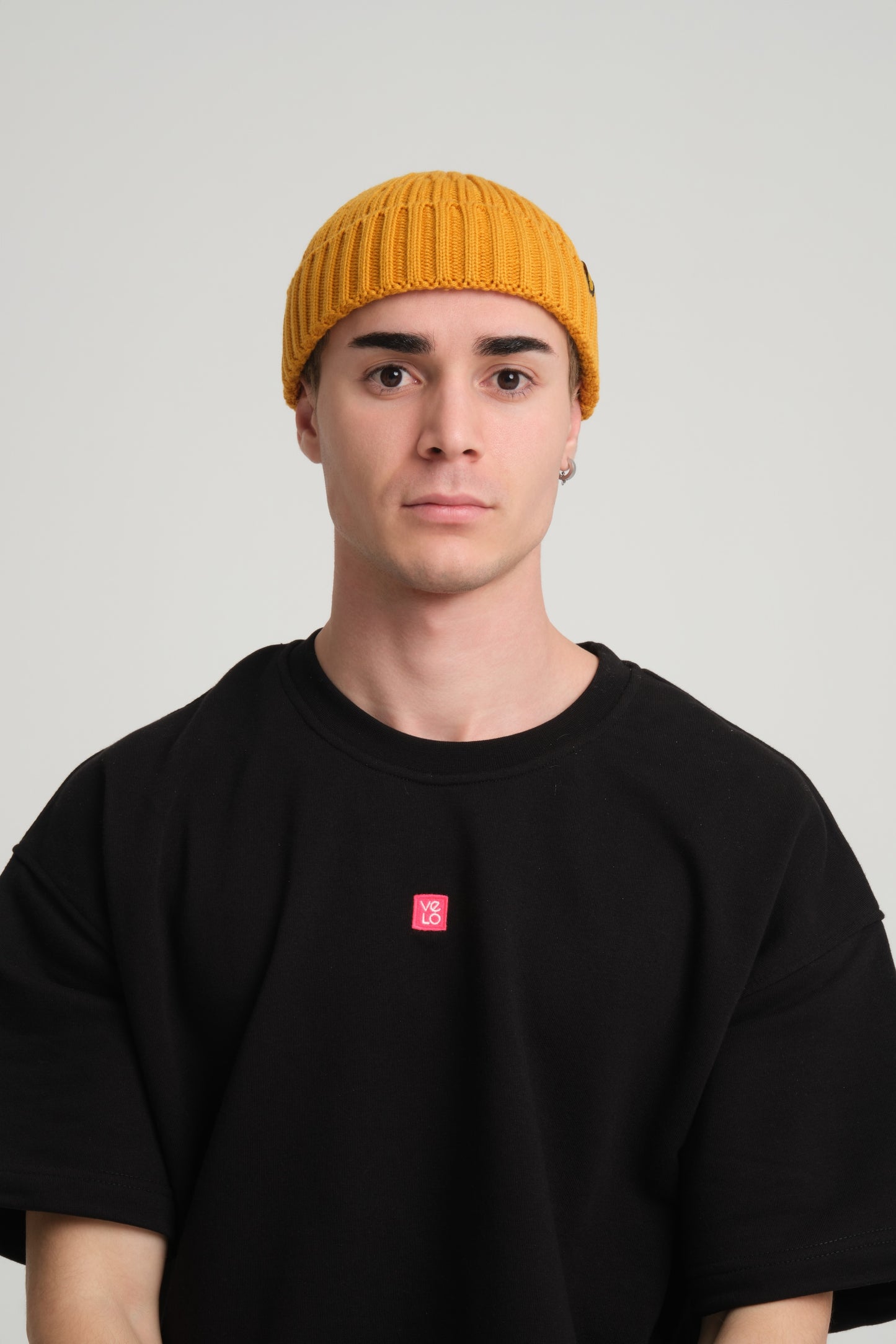 front view of a man wearing Mustard Fisherman Beanie