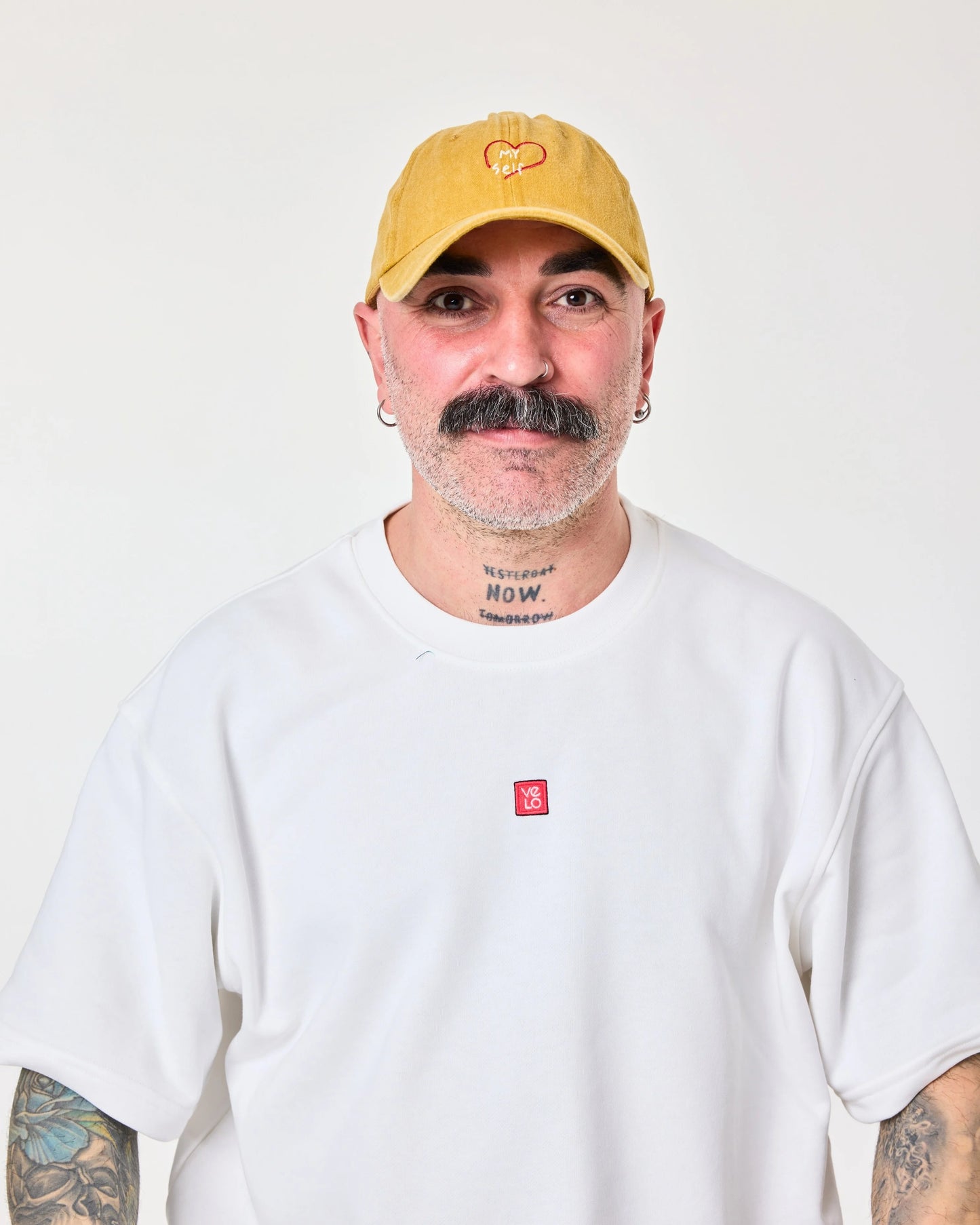 front view of man wearing Love Myself Mustard Washed Cap