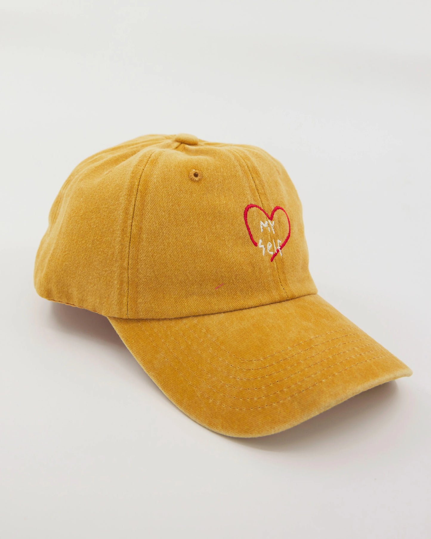 side view of Love Myself Mustard Washed Cap