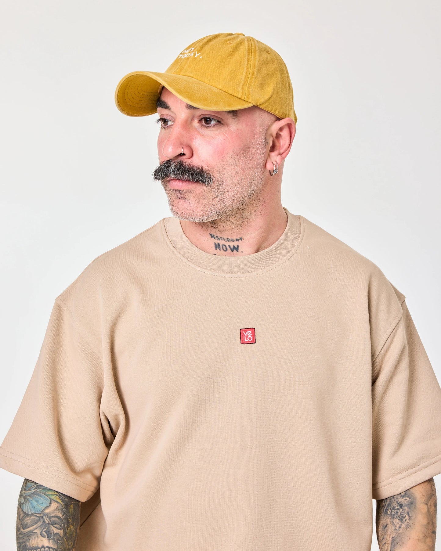 man wearing Mustard Washed Cap with Not Today embroidered in white