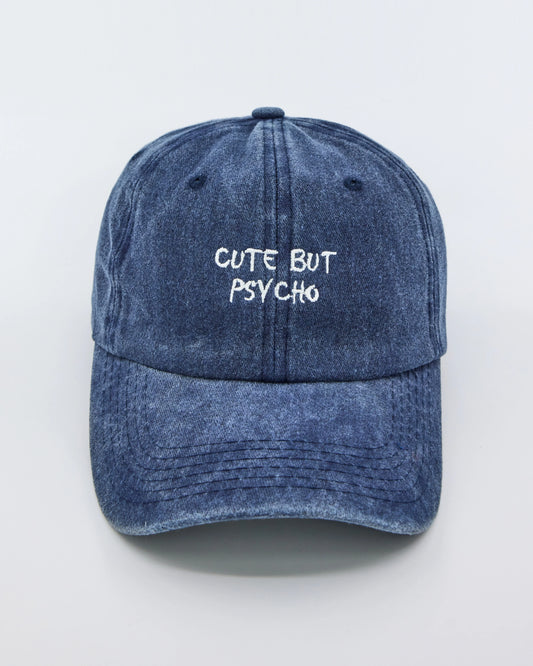 front view of Cute But Psycho Navy Blue Washed Cap