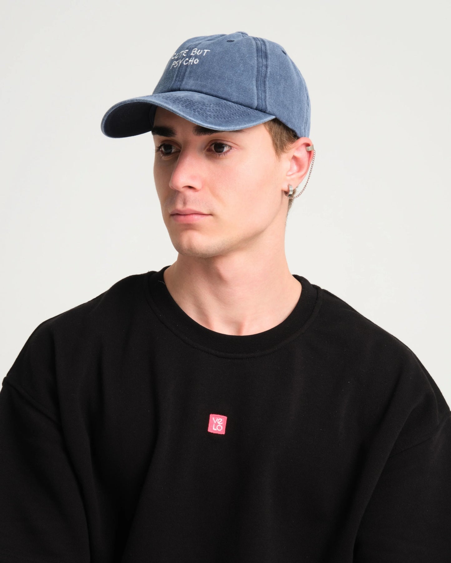 side view of man wearing Cute But Psycho Navy Blue Washed Cap