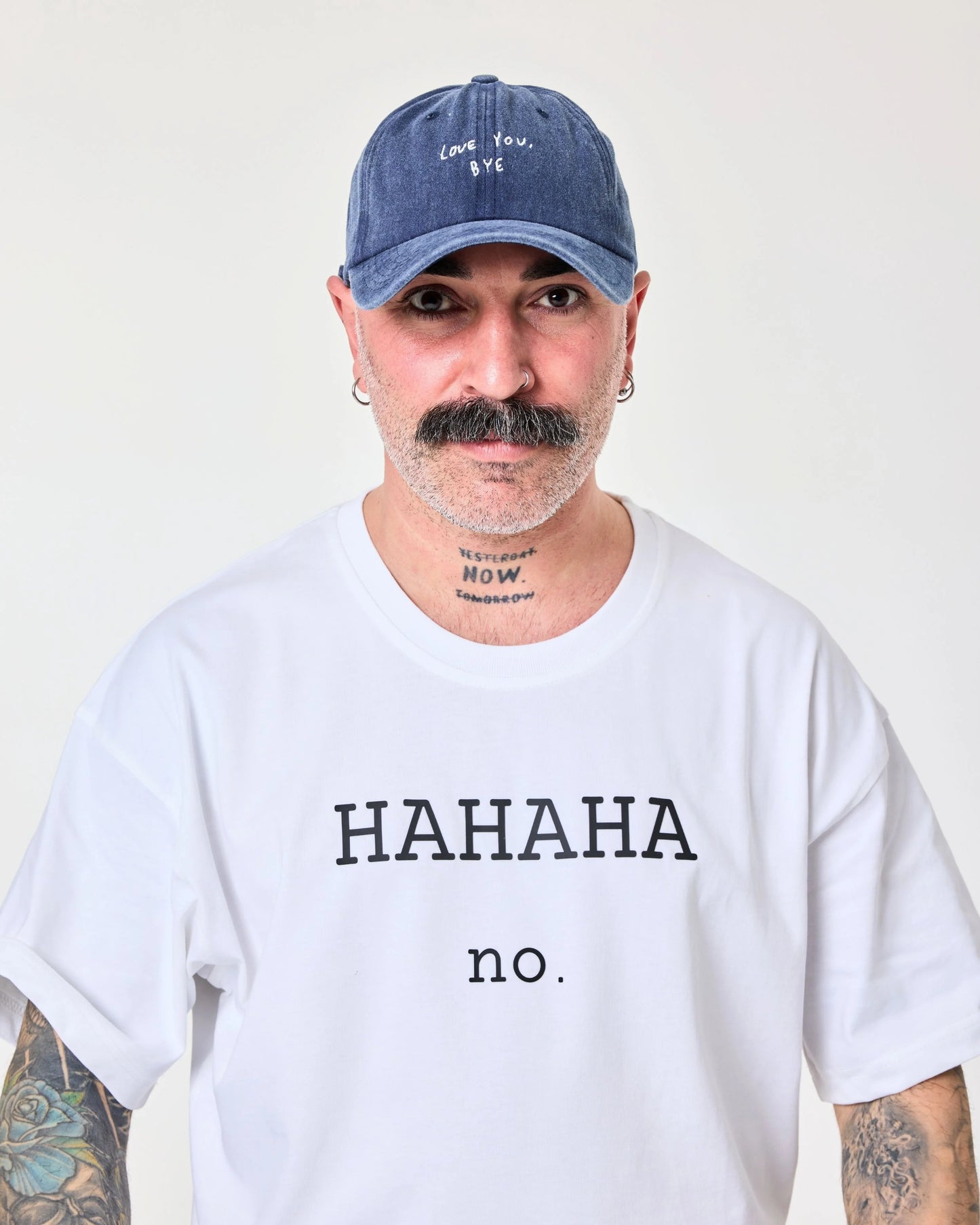 man wearing Navy Blue Washed Cap with Love You Bye embroidered in white