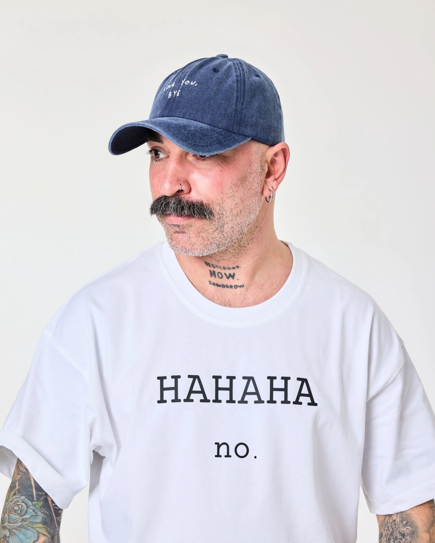 man wearing Navy Blue Washed Cap with Love You Bye embroidered in white
