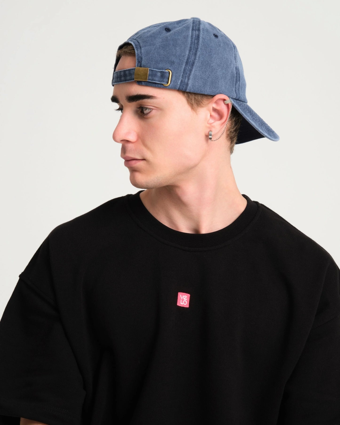 man wearing back of Navy Blue Washed Cap with Love You Bye embroidered in white
