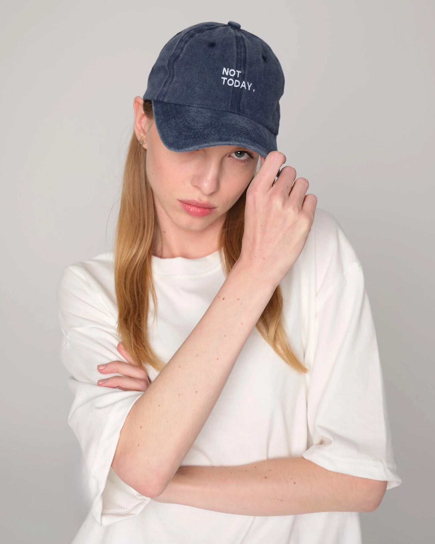 woman wearing Navy Blue Washed Cap with Not Today embroidered in white