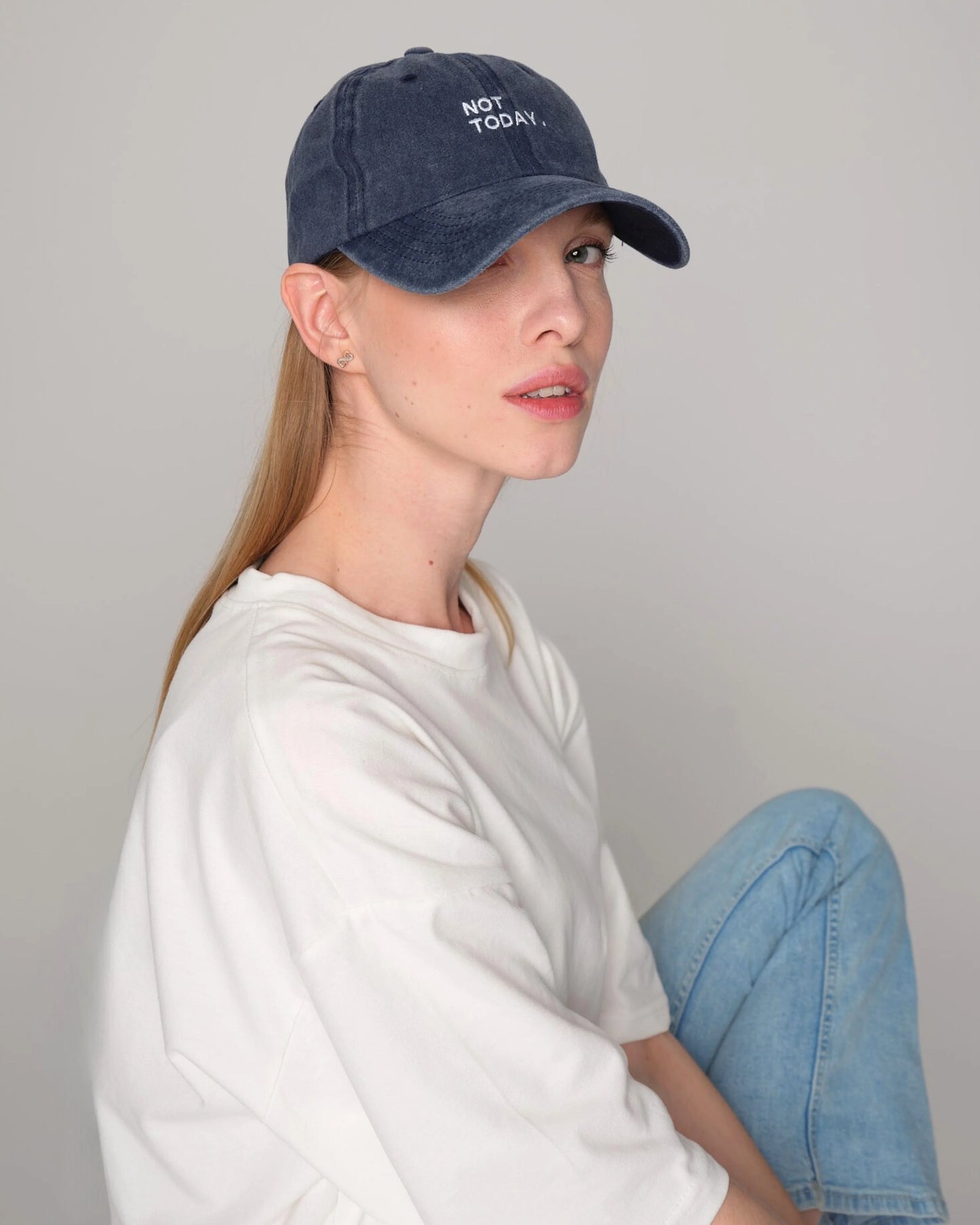 woman wearing Navy Blue Washed Cap with Not Today embroidered in white