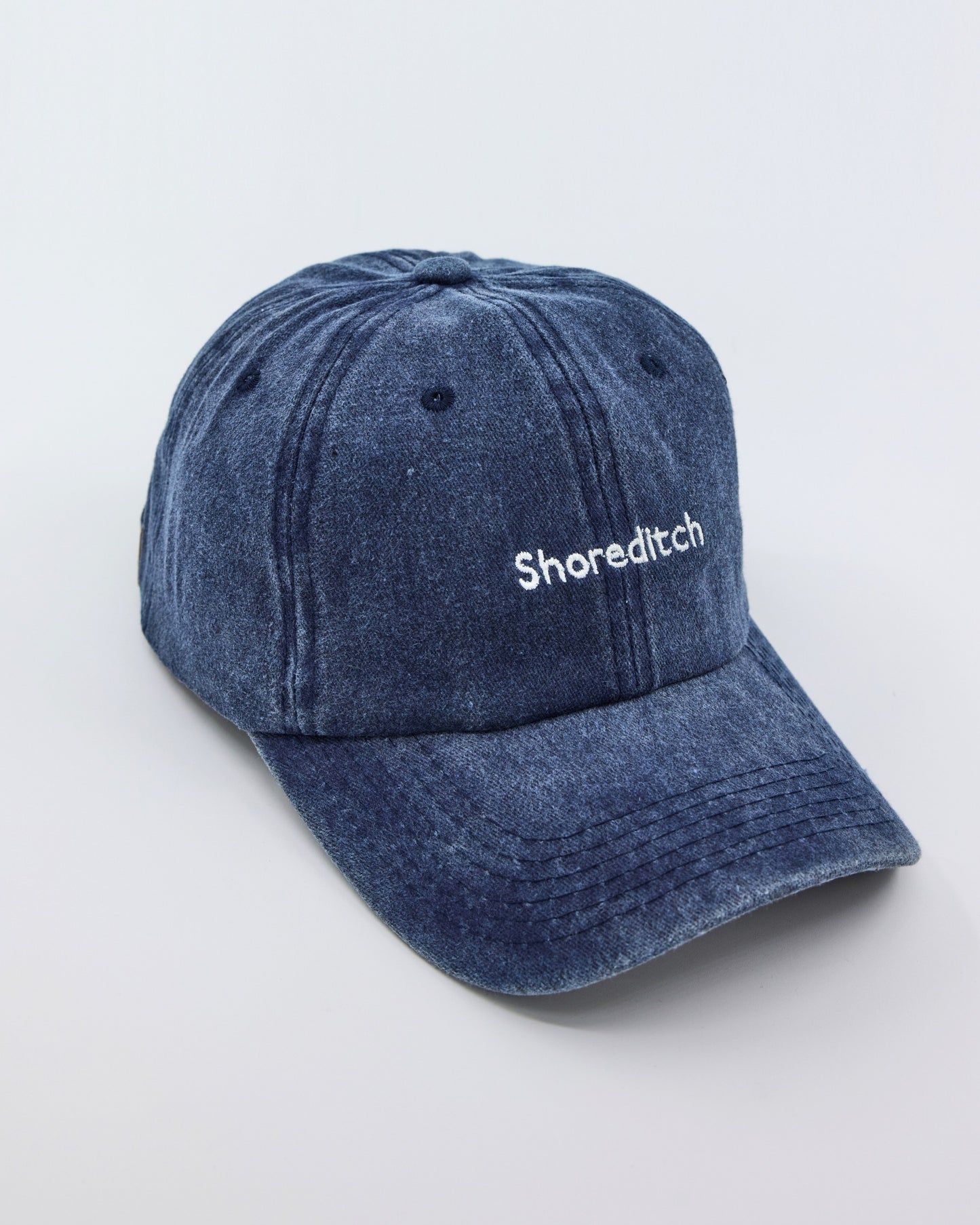 side view of Navy Blue Shoreditch Washed Cap