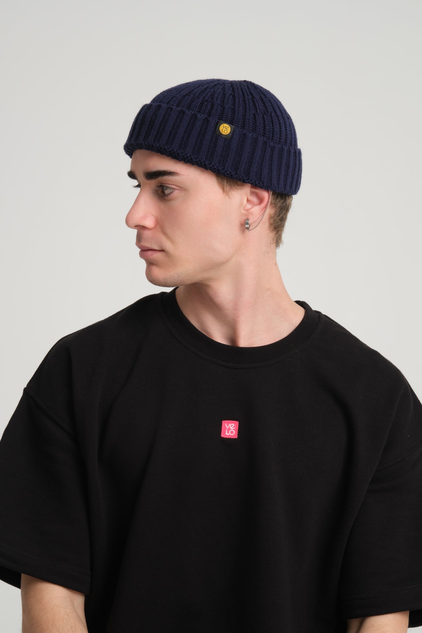 side view of a man wearing Navy Fisherman Beanie