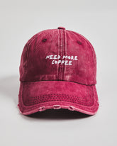 Front view of Need More Coffee Cherry Washed Cap