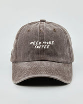 Front view of Need More Coffee Dusty Brown Washed Cap