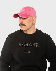 A man wearing the Need More Coffee Hot Pink Washed Cap