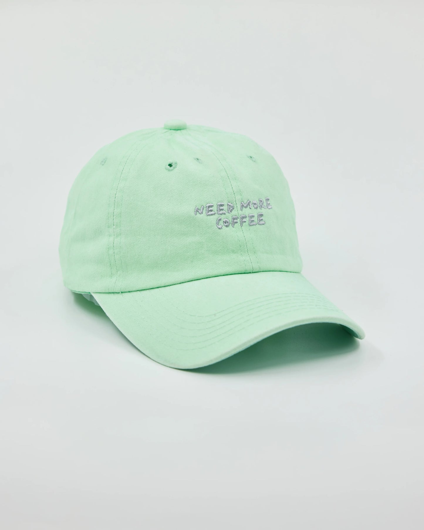 Side view of Need More Coffee Light Green Washed Cap