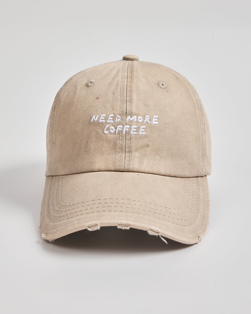 Front view of Need More Coffee Oat Washed Cap