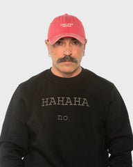A man wearing the Need More Coffee Red Washed Cap