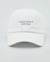 Front view of Need More Coffee White Washed Cap