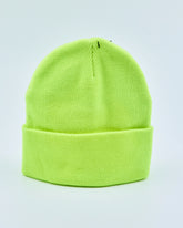 Neon green beanie on a light gray background