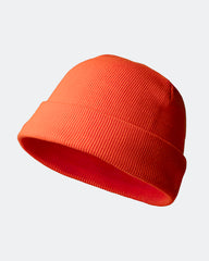 Neon orange beanie hat on a light gray background