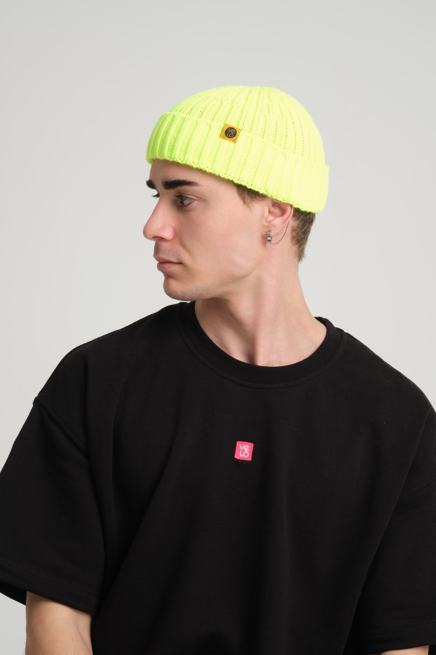 side view of a man wearing Neon Yellow Fisherman Beanie