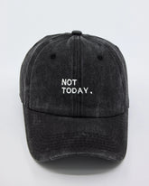 A black washed cap with the text 'NOT TODAY,' embroidered on the front.