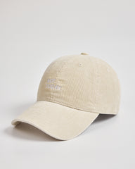 Cream cap with text on a light gray background