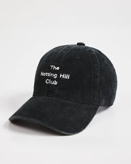 Black cap with 'The Notting Hill Club' text on a white background