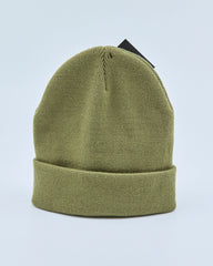Olive green beanie on a light blue background