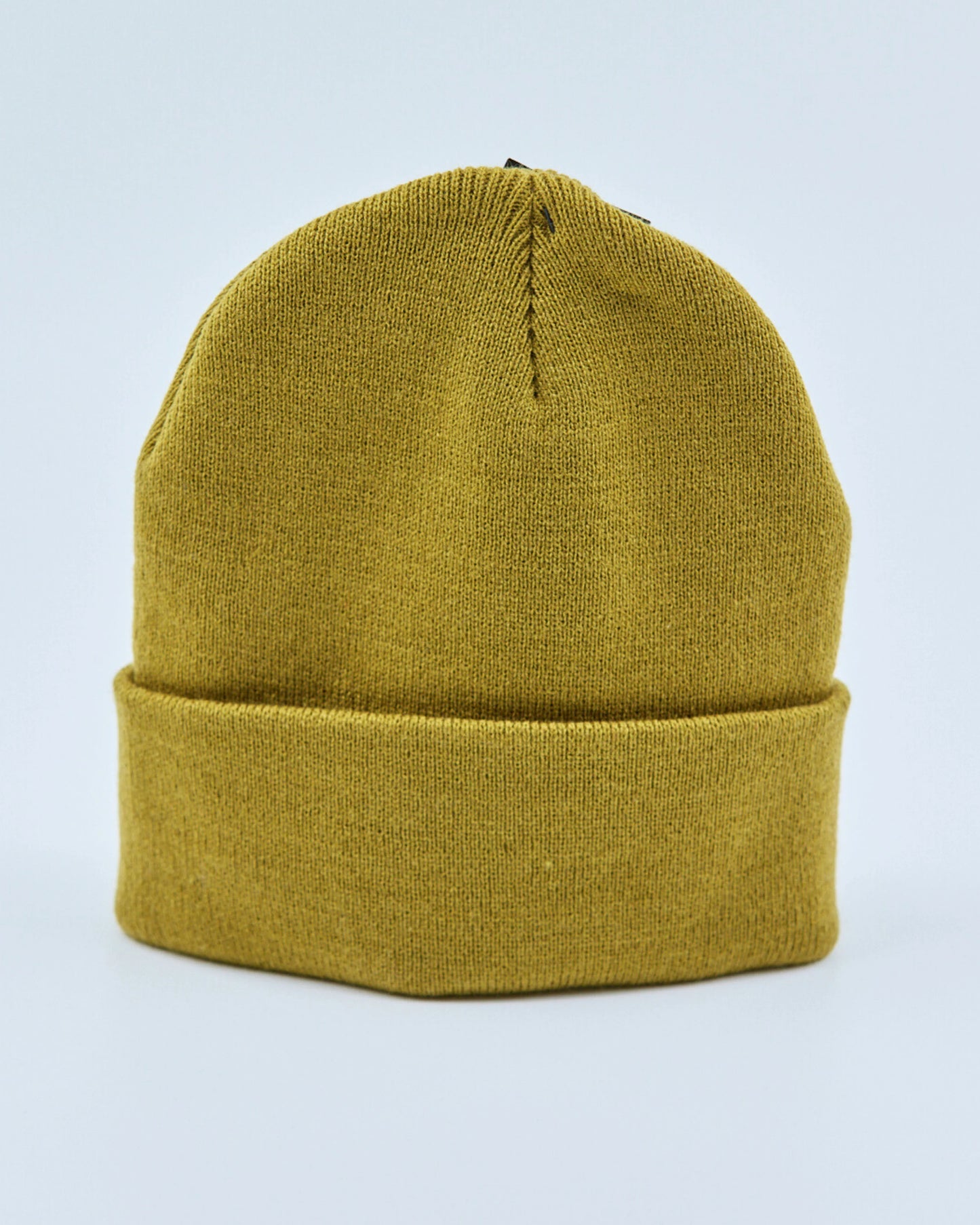 Yellow beanie on a light blue background