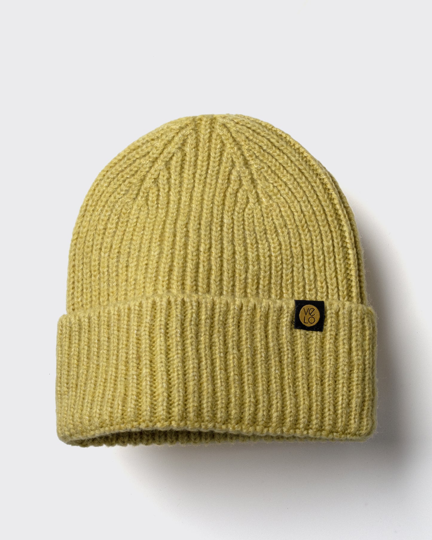 Olive Yellow Lux Beanie on a light gray background