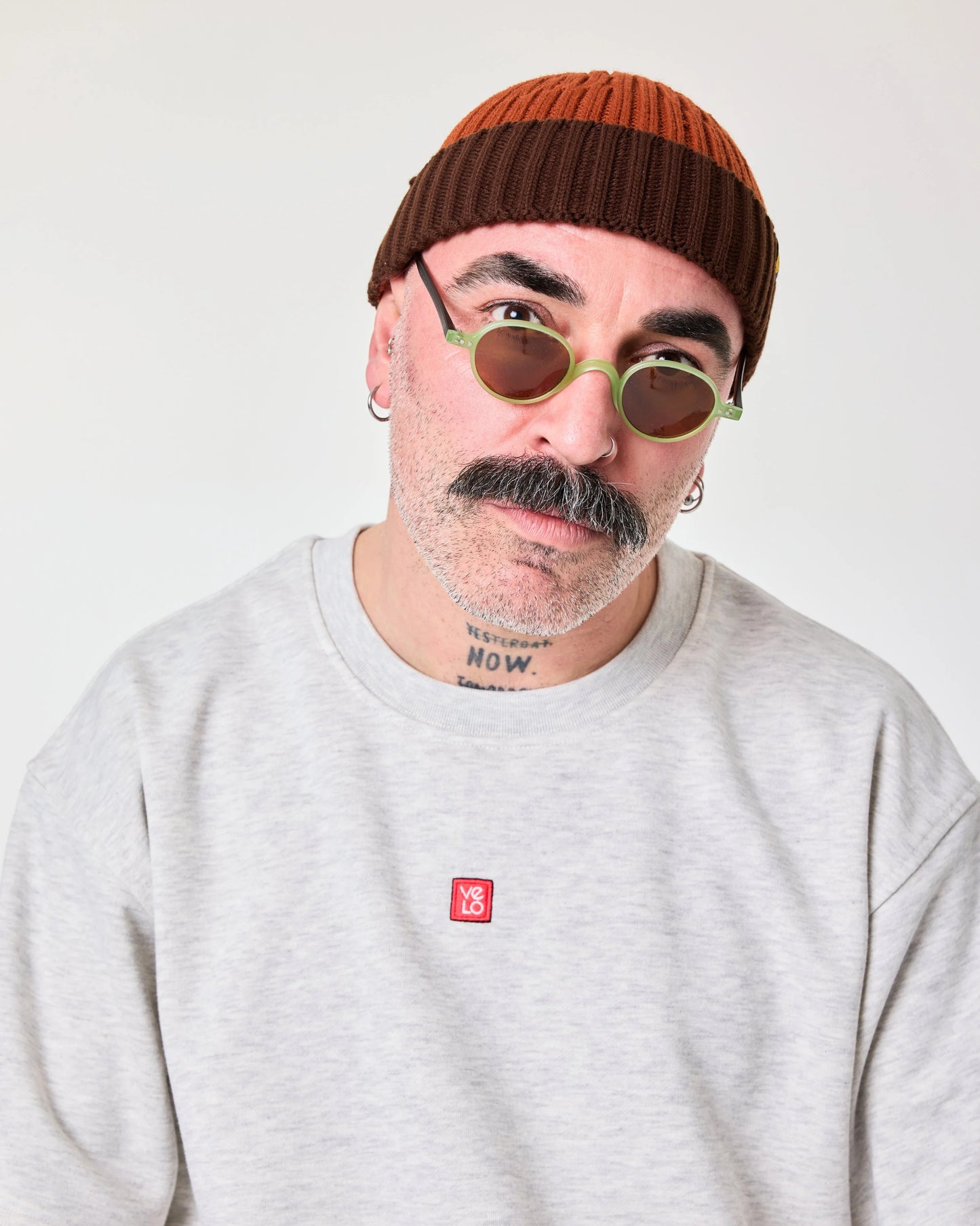 front view of a man wearing Orange Crochet Pattern Fisherman Beanie