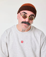 front view of a man wearing Orange Crochet Pattern Fisherman Beanie