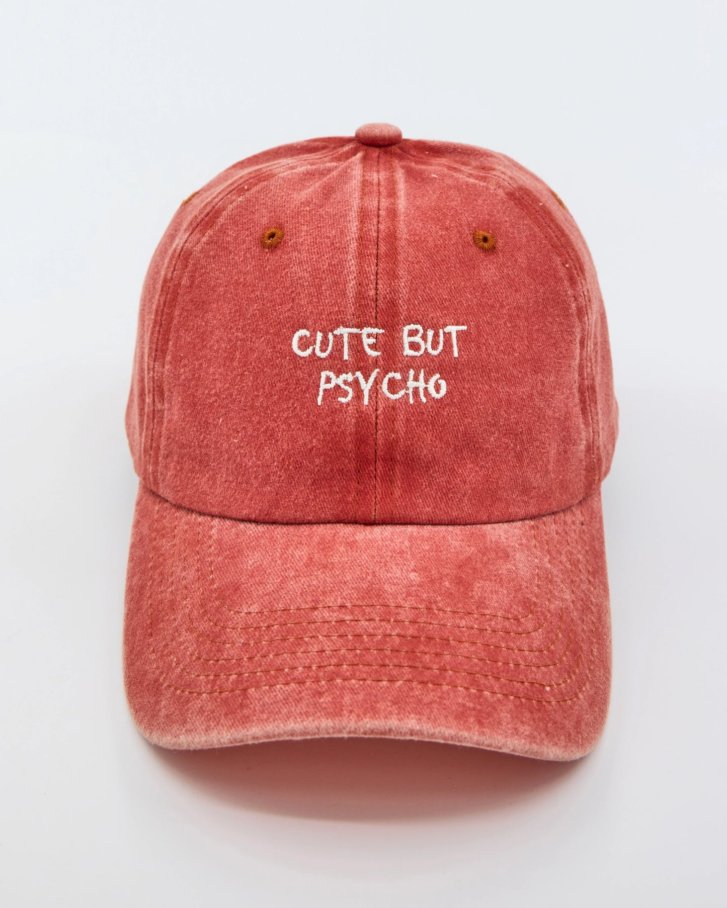 front view of Cute But Psycho Orange Washed Cap