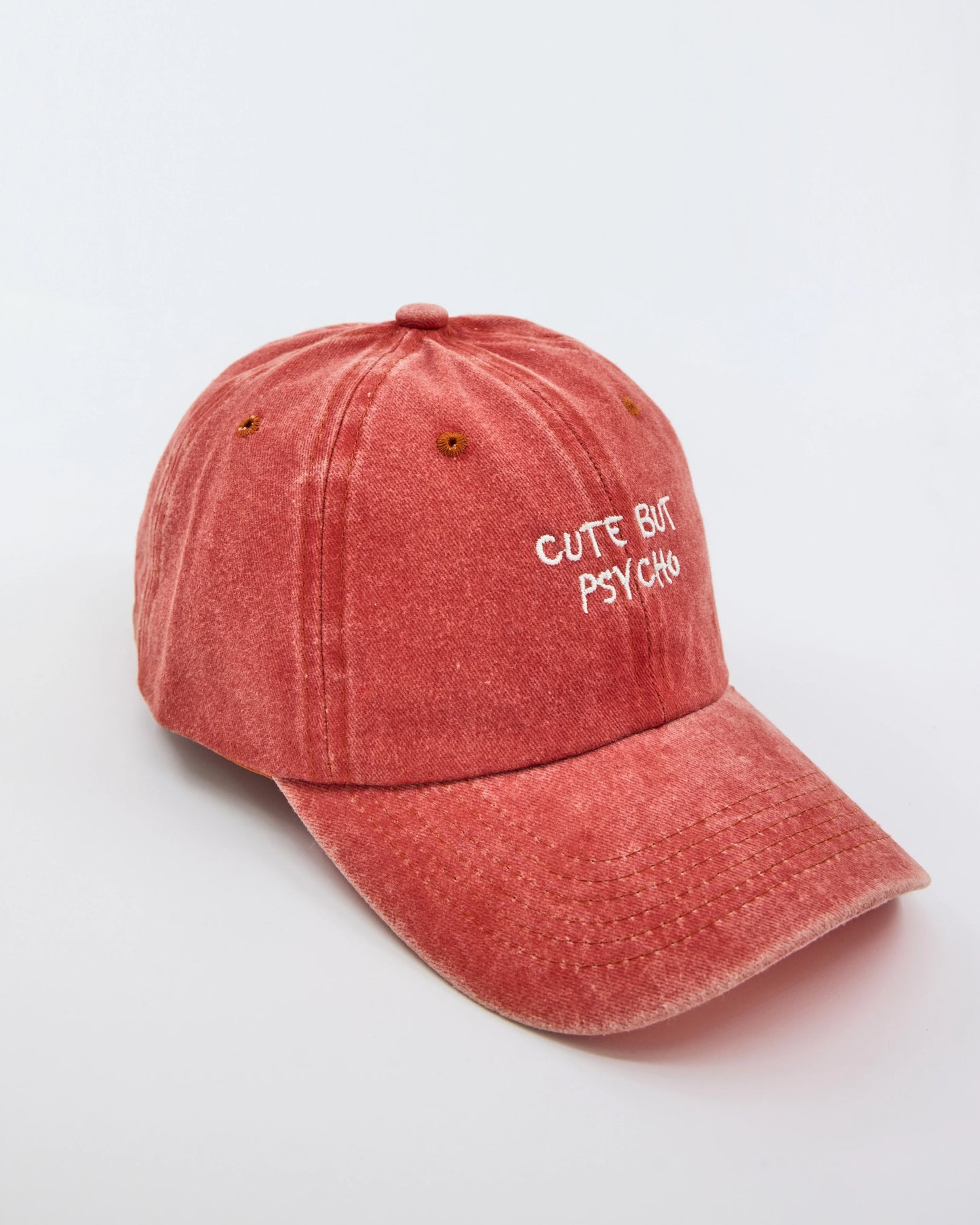 side view of Cute But Psycho Orange Washed Cap