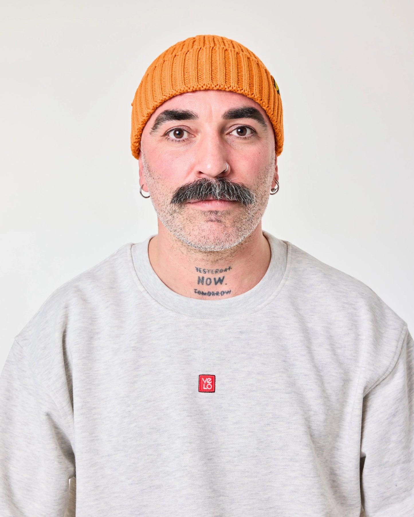 front view of a man wearing Orange Fisherman Beanie