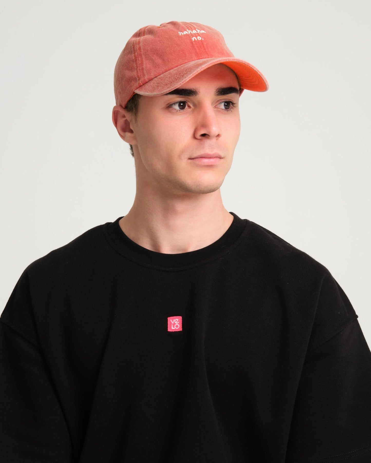 man wearing Orange Hahaha No Washed Cap
