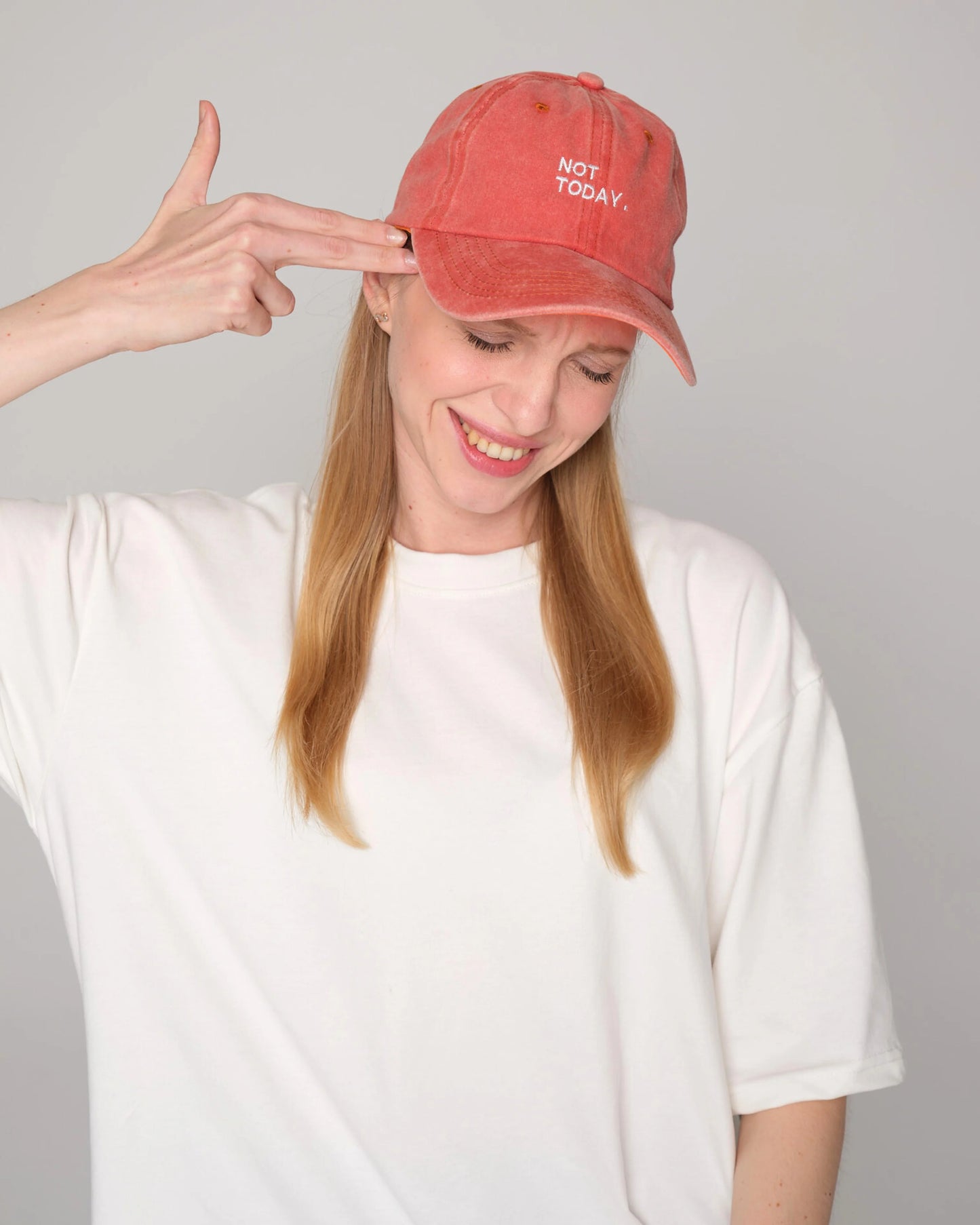 woman wearing Orange Washed Cap with Not Today embroidered in white