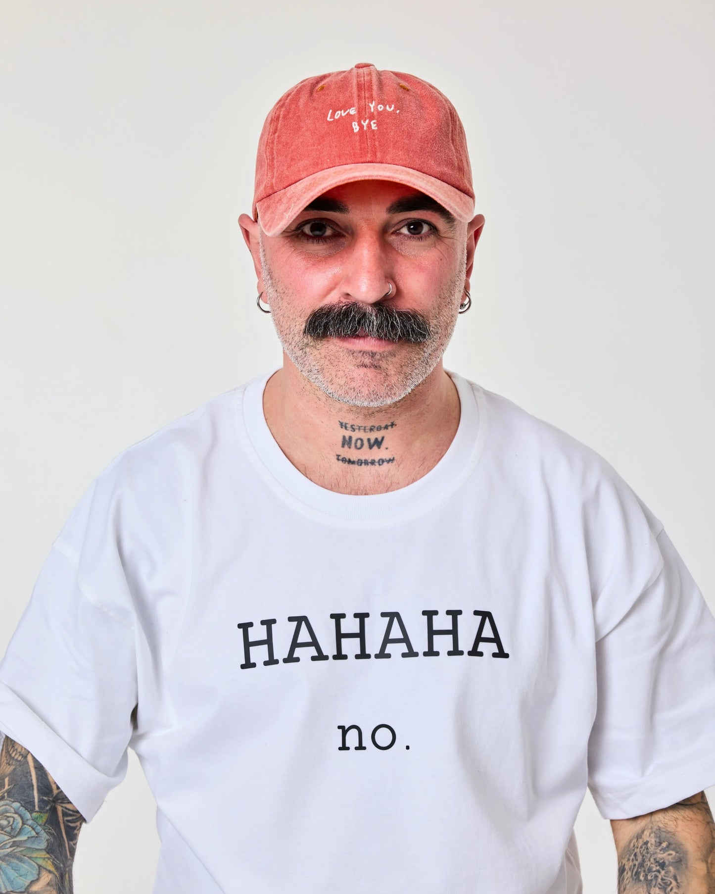front view of a man wearing Love You Bye Orange Washed Cap