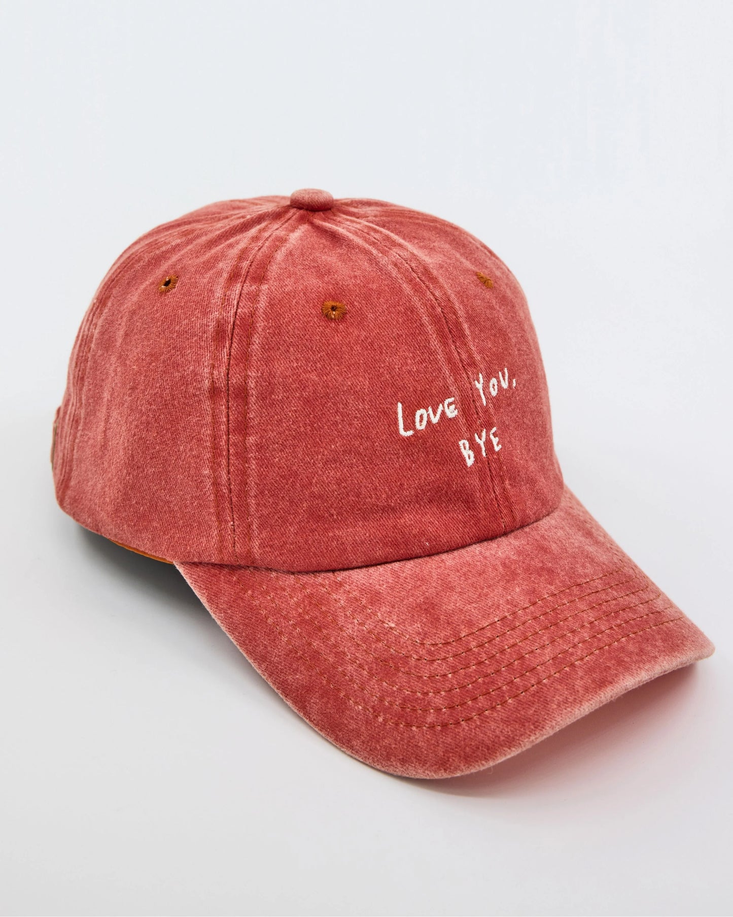 side view of Love You Bye Orange Washed Cap