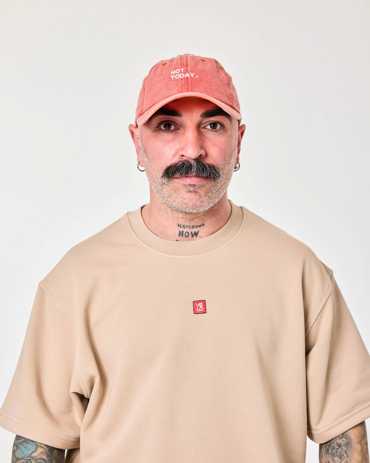 man wearing Orange Washed Cap with Not Today embroidered in white