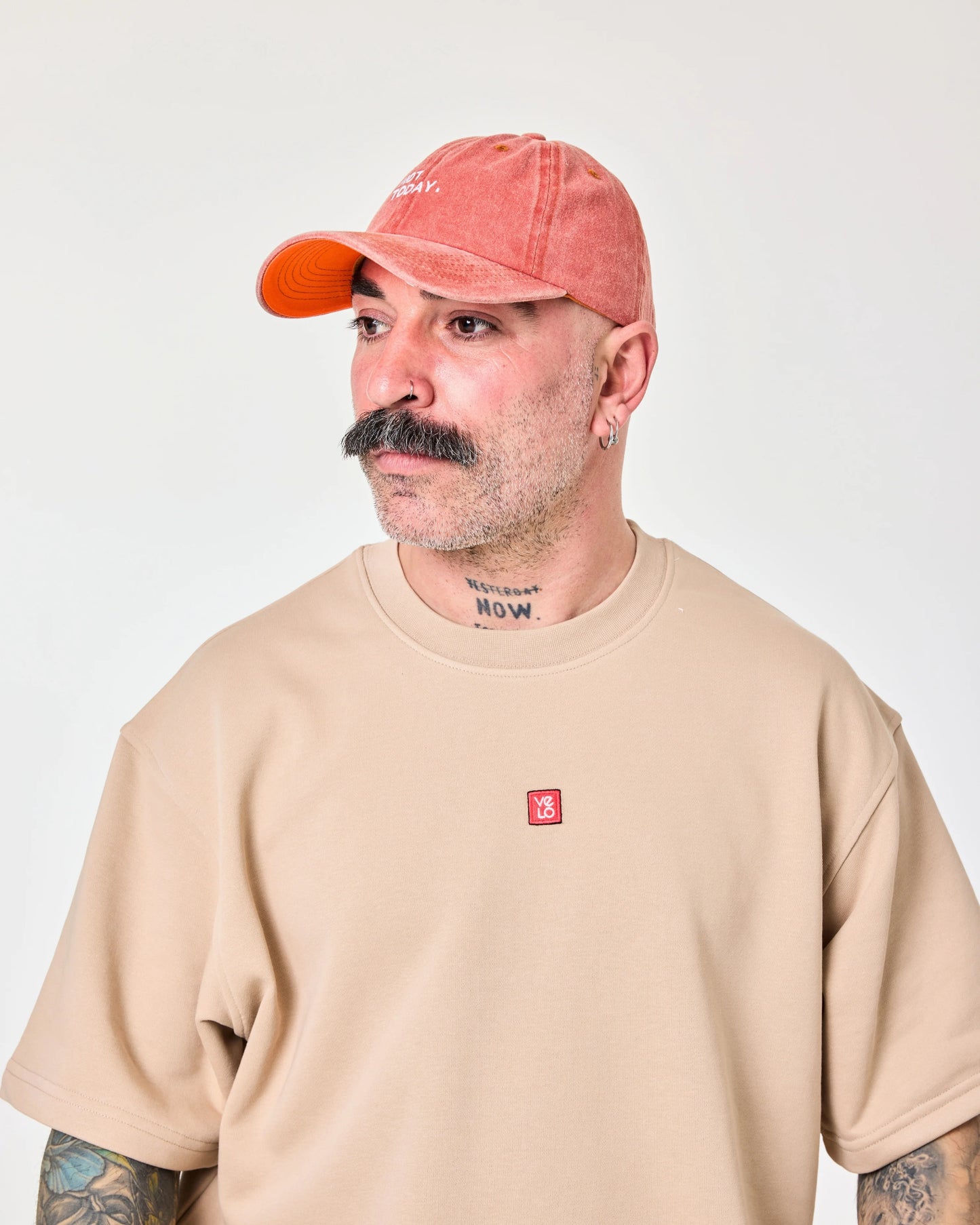 man wearing Orange Washed Cap with Not Today embroidered in white
